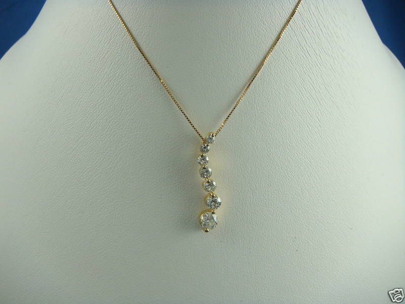 14 K. DIAMOND JOURNEY PENDANT YELLOW GOLD 0.50 CT.  