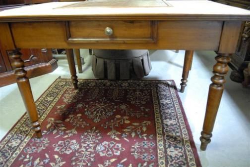 that has been restored with yellow tile top and built in cutting board 